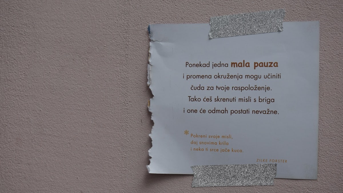 white printer paper on brown wall